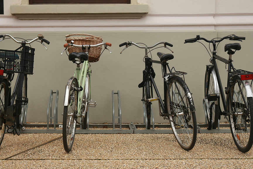 Example of proper bike rack spacing showing multiple bicycles parked with adequate clearance for easy access and maneuverability.